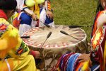 Indians around a drum at a Pow Wow Indians druming